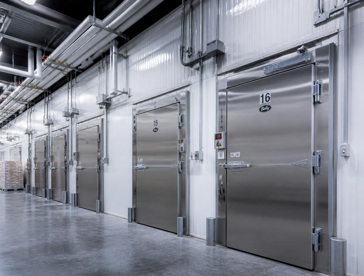 Stainless steel cold room doors in a commercial refrigeration facility